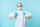 Optimistic asian nurse or doctor, wearing personal protective equipment, showing thumbs up, campaign from coronavirus prevention, blue background.